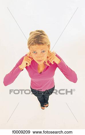 Studio attitudes, lifestyle, making-a-face, ear, noise View Large Photo Image Stock Photo - Studio attitudes, lifestyle, making-a-face, ear, noise. Fotosearch