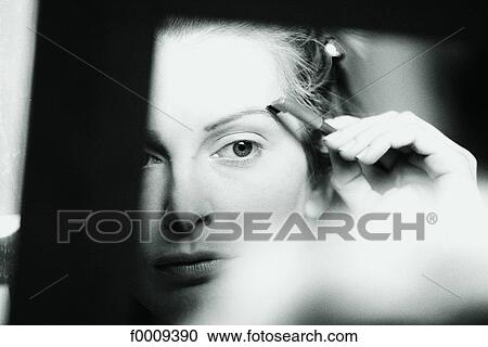 Stock Image - In the mirror, lifestyle, inside, indoor, indoor shots. Fotosearch
