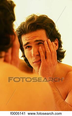Stock Image - In the mirror, lifestyle, people, adults. Fotosearch