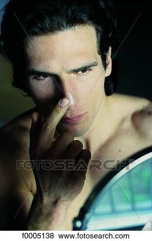 Stock Photo - In the mirror, lifestyle, people, adults. Fotosearch