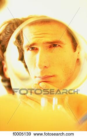 Stock Photo - In the mirror, lifestyle, people, adults. Fotosearch