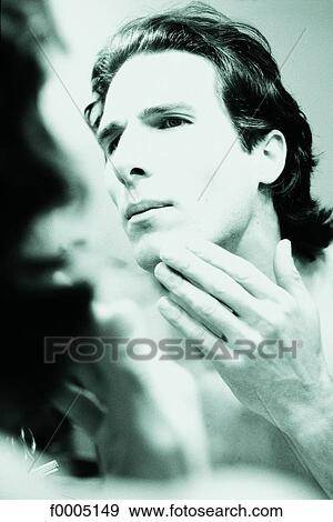 Stock Photo - In the mirror, lifestyle, people, adults. Fotosearch