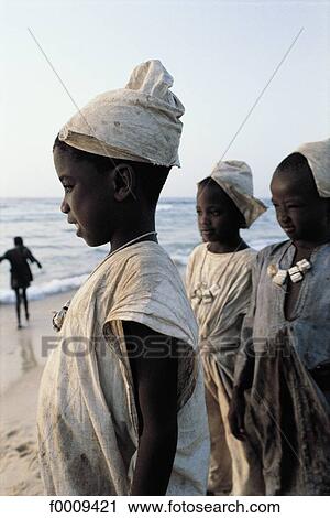 Senegal, Cayar beach, young boys in their circumcision outfits View Large Photo Image Stock Image - Senegal, Cayar beach, young boys in their circumcision outfits. Fotosearch