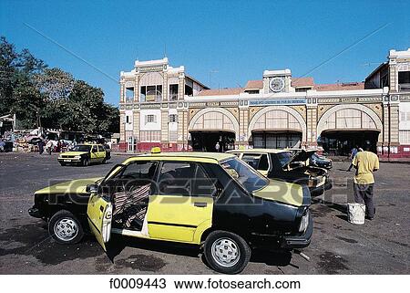 Stock Image - Senegal, Dakar, taxis in front of the railroad station. Fotosearch