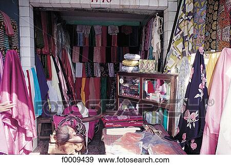 Senegal, Sine-Saloum, Kaolack, seamstress stand at market View Large Photo Image Stock Photo - Senegal, Sine-Saloum, Kaolack, seamstress stand at market. Fotosearch