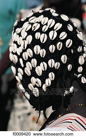 Senegal, Young Bassari woman, hairstyle with cauris View Large Photo Image Stock Image - Senegal, Young Bassari woman, hairstyle with cauris. Fotosearch