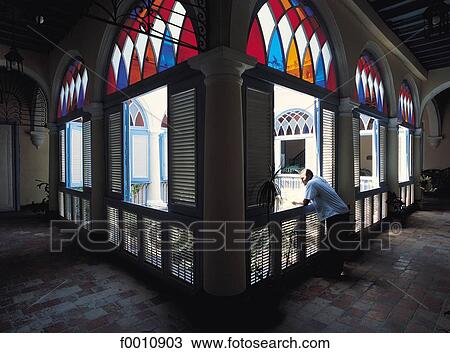 Stock Image - Havana, old colonial house, typical windows. Fotosearch