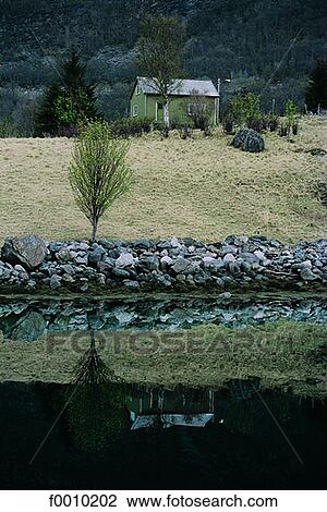 Stock Image - Trondheim vicinity, the coast in a fjord. Fotosearch