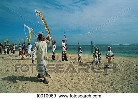 Stock Photo - Odalan procession on Nusa Dua beach. Fotosearch