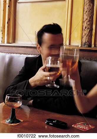 Stock Image - Mort Subite Café, friends drinking beer. Fotosearch