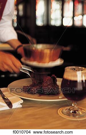 Picture - Serving a Waterzoie. Fotosearch