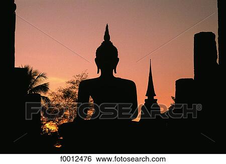 Thailand, Sukhothai, Buddha at dusk View Large Photo Image Stock Photograph - Thailand, Sukhothai, Buddha at dusk. Fotosearch
