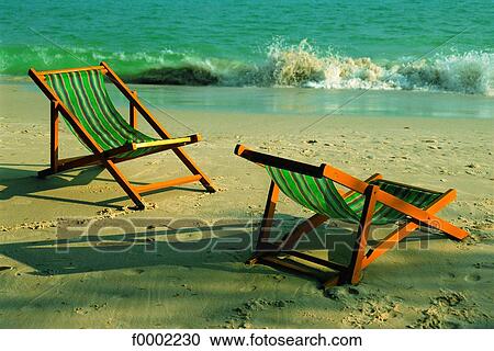 Thailand, two deck chairs on a beach View Large Photo Image Stock Image - Thailand, two deck chairs on a beach. Fotosearch