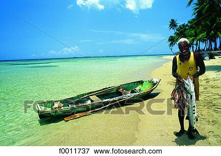 Domenican Republic, Punta Bonita beach, fisherman and catch View Large Photo Image Stock Photo - Domenican Republic, Punta Bonita beach, fisherman and catch. Fotosearch