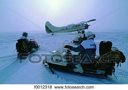 Stock Photo - Snow scooter tour. Fotosearch