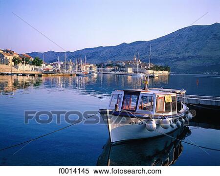 Korcula Island, fishing boat and the ramparts at sunrise View Large Photo Image Stock Photography - Korcula Island, fishing boat and the ramparts at sunrise. Fotosearch