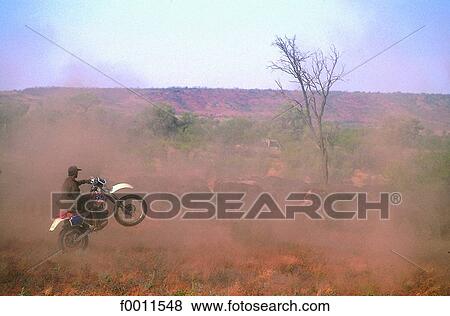 Australia, Northern territories, biker-farmer near Alice Springs View Large Photo Image Stock Photo - Australia, Northern territories, biker-farmer near Alice Springs. Fotosearch