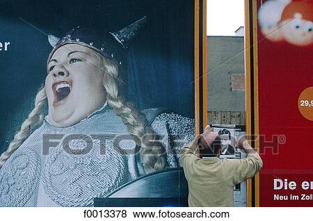 Stock Photo - Ad signs at Checkpoint Charlie. Fotosearch