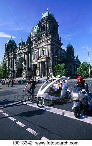 Stock Image - Cathedral, bike and pedicab. Fotosearch