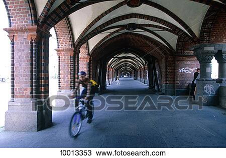 Stock Image - Oberbaumbrücke bridge quarter, the vaulted tunnel under the railway line. Fotosearch