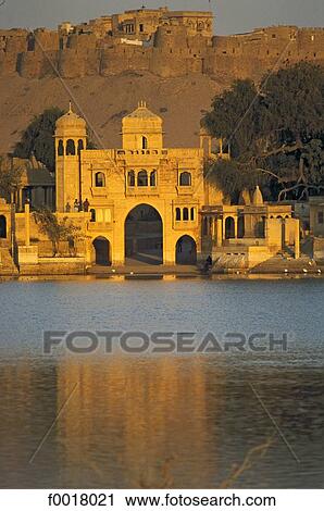 India, Rajasthan, Jaisalmer, Fort and pavillions surrounding Gadi Sagar lake View Large Photo Image Stock Image - India, Rajasthan, Jaisalmer, Fort and pavillions surrounding Gadi Sagar lake. Fotosearch