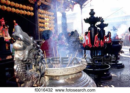 Stock Image - China, Taiwan, incense and offerings. Fotosearch