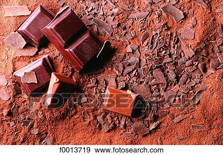 Cocoa and chocolate pieces View Large Photo Image Stock Photo - Cocoa and chocolate pieces. Fotosearch