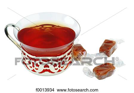 Picture - Tea and caramels. Fotosearch