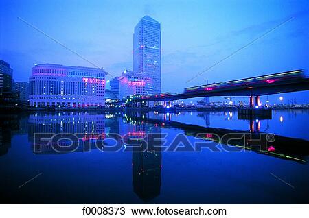 London, Canary warf and the DLR train at dusk View Large Photo Image Stock Image - London, Canary warf and the DLR train at dusk. Fotosearch
