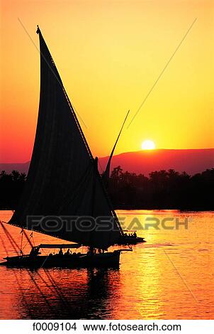 Egypt, Aswan, sunset and felucca View Large Photo Image Picture - Egypt, Aswan, sunset and felucca. Fotosearch