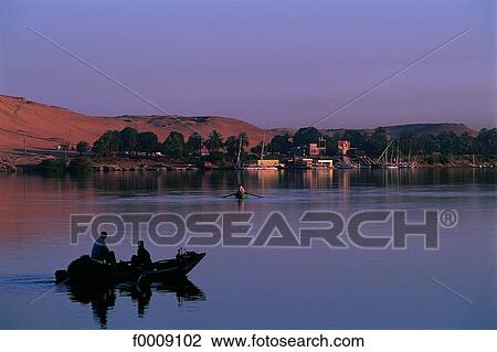 Egypt, Aswan, the Nile, fishermen at dusk View Large Photo Image Stock Image - Egypt, Aswan, the Nile, fishermen at dusk. Fotosearch