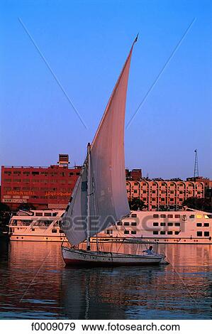 Egypt, The Nile, felucca and liner View Large Photo Image Stock Photo - Egypt, The Nile, felucca and liner. Fotosearch