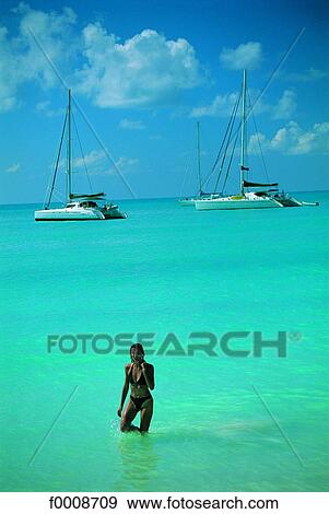 Stock Photo - Virgin Islands, young woman and boats. Fotosearch