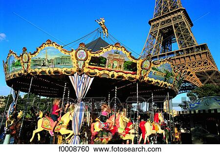 Stock Image - France, Paris, Merry-go-round at the Eiffel Tower. Fotosearch