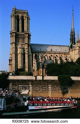 Stock Photography - France, Paris, River-boat in front of Notre Dame. Fotosearch