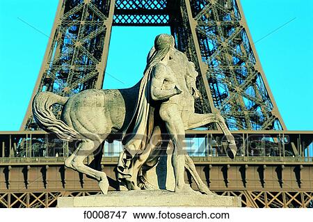 France, Paris, Statue in front of the Eiffel Tower View Large Photo Image Stock Photo - France, Paris, Statue in front of the Eiffel Tower. Fotosearch