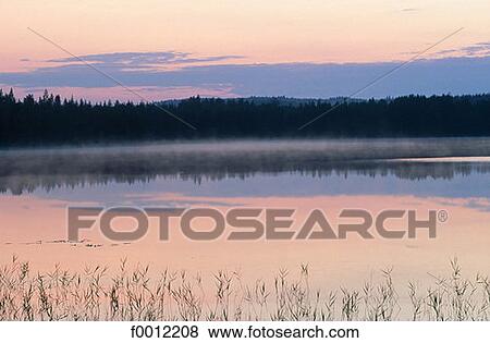 Stock Photo - Finland, Carelia, Nurmes vicinity at dusk. Fotosearch