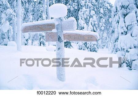 Stock Image - Finland, Lapland, road sign near Rovaniemi. Fotosearch