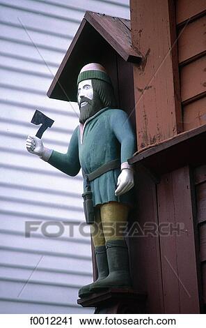 Stock Image - Norway, Bergen, wooden sculputer in Brydden district. Fotosearch
