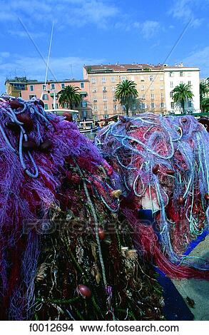 Picture - Corsica, Ajaccio, harbour, fishing nets. Fotosearch