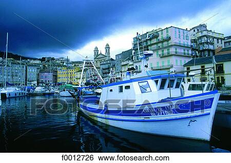 Stock Photograph - Corsica, Bastia, stormy weather on the old harbour. Fotosearch
