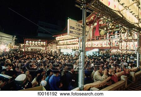 Stock Image - Japan, Tokyo, Asakusa temple, Tori-no-ichi ceremony, prayers. Fotosearch