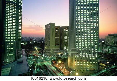 Stock Image - Japan, Tokyo, Shinjuku, business district at dusk. Fotosearch