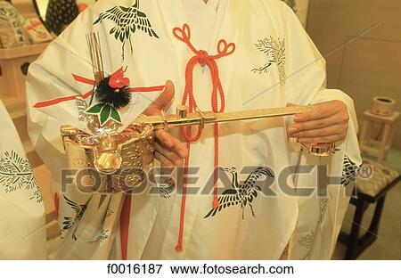 Japan, Tokyo, traditional wedding, Shinto priest celebrating the ceremony View Large Photo Image Stock Photo - Japan, Tokyo, traditional wedding, Shinto priest celebrating the ceremony. Fotosearch