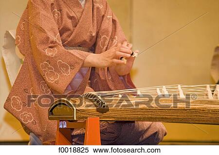 Stock Photography - Japan, Kyoto, Gion, playing koto. Fotosearch