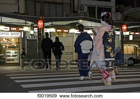 Stock Photo - Japan, Kyoto, Gion quarter, Maiko walking. Fotosearch