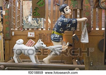 Stock Photo - Japan, Kyoto, shop window, humoristic figurine. Fotosearch