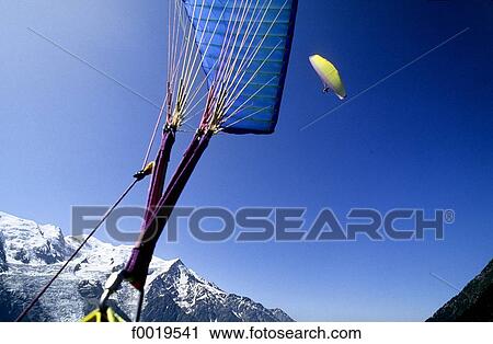 Stock Image - France, Alps, Chamonix valley, paragliding. Fotosearch