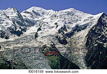 Stock Photo - France, Alps, Mont Blanc region, paragliding. Fotosearch