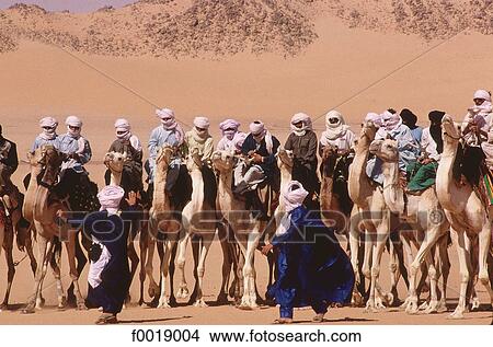 Algeria, Tassili n'Ajjer, Djanet, camel race during the Sebiba (Tuareg festival) View Large Photo Image Picture - Algeria, Tassili n'Ajjer, Djanet, camel race during the Sebiba (Tuareg festival). Fotosearch